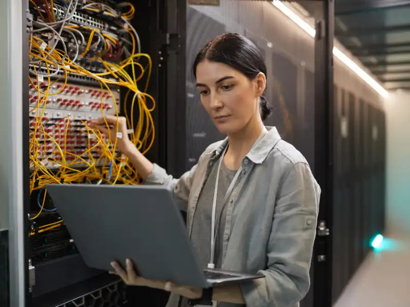 Prime Tech Support technician performing and setting up a network service for business in Miami