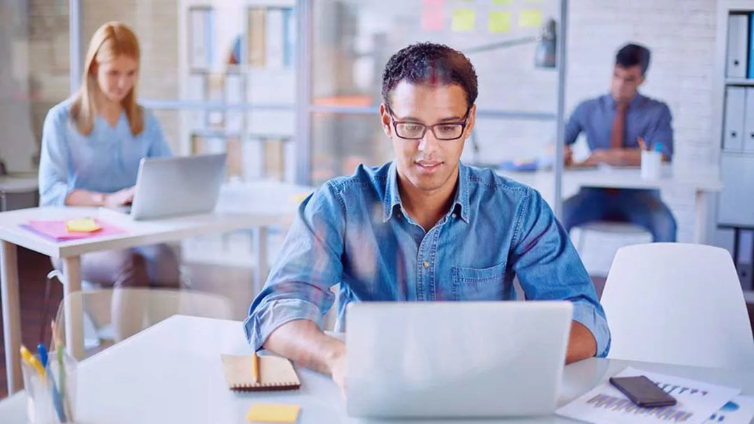 Business Person working on his laptop after Prime Tech Business set up his business network system in Miami, Florida