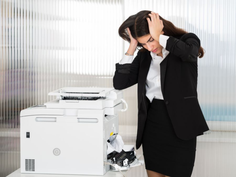 Woman with printer not working while waiting for Prime Tech Support IT Specialist